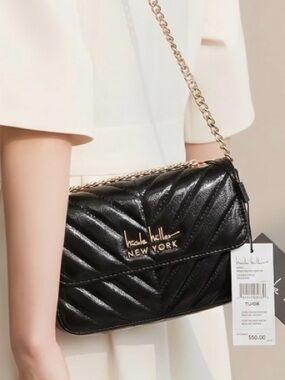 Venue Nicole Miller, New York, black shiny purse with long gold chain